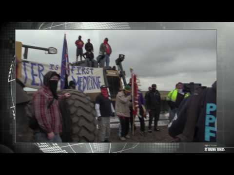 Native American Family Chain Themselves To Drilling Equipment